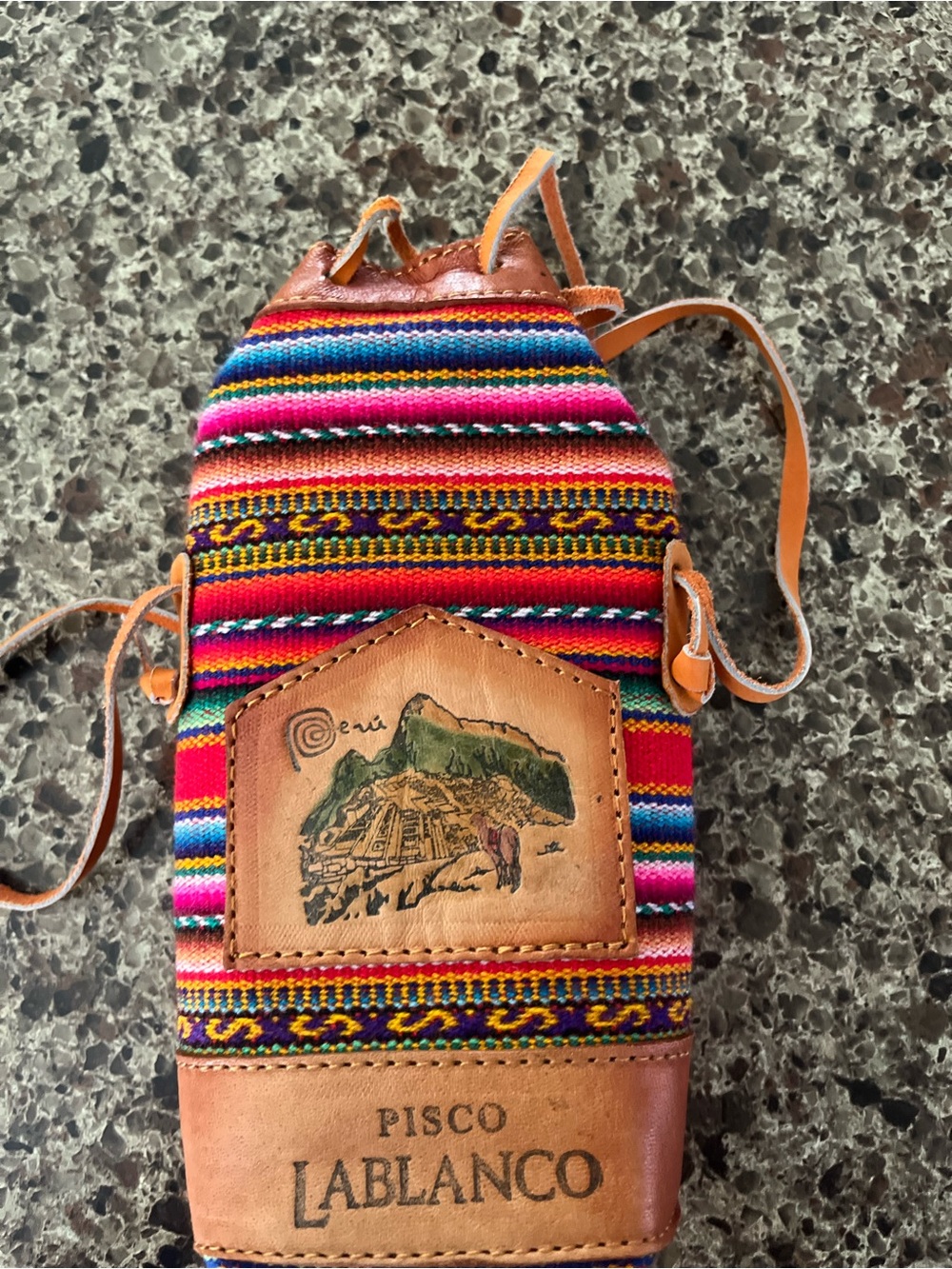 Peruvian Pisco pouch with vibrant striped pattern - Picture 1 of 5